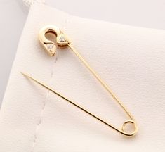 14k yellow gold safety pin Diamond brooch  (0.05ctw Diamonds) About 1.5 gram's 1.5'' long Please note these pins are not mass produced or cast , each and every one is handmade in our shop with care and great attention to detail. The jewelry we make is made with recycled and re-refined environmentally responsible precious metals. Handmade in USA Very Special Piece Gold Safety Pin Lapel Pin Gift, Gold Safety Pin Lapel Pin For Gift, Gold Safety Pin Shaped Brooch, Gold Safety Pin Shaped Brooch Jewelry, Classic Yellow Gold Brooch Pin, Gold Safety Pin Lapel Brooch, Safety Pin Earrings, Diamond Brooch, Boston Ma