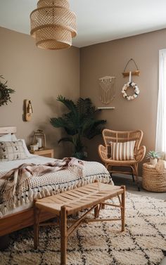 a bed room with a neatly made bed and two wicker chairs next to it