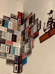 there is a wall made out of old cassettes