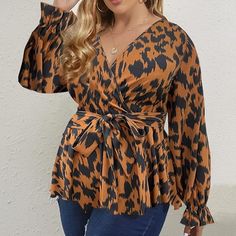 This fashionable Plus Size Leopard Brown Long Sleeve Peplum Wrap Top is the perfect addition to any wardrobe. The lightweight fabric and slim fit design are flattering for any body type, while the leopard pattern gives off a unique, trendy style. It's a must-have for any modern woman. 100% Polyester Imported Pull On closure Machine Wash Brand Size Dress Bust Waist Hip XS 0-2 31-32.5'' 23-24'' 31-34" S 4--6 33-35'' 25-26'' 35-37" M 8--10 35-36'' 27-28'' 38-39" L 12--14 38-40'' 29-31'' 40-42" XL 1 Trendy Leopard Print V-neck Blouse, Leopard Print Blouse For Fall, Fitted Tiger Print Top For Fall, Fall Tiger Print Tops, Fall Leopard Print Stretch Blouse, Chic Fall Tiger Print Tops, Fitted Leopard Print Blouse For Work, Trendy Long Sleeve Tiger Print Tops, Spring Leopard Print Stretch Blouse