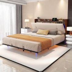 a bedroom with a large bed and white walls