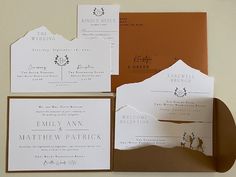 the wedding stationery is laid out on top of each other