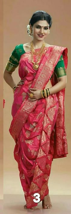 a woman in a pink and green sari