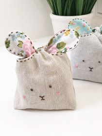 two small bags with bunny ears on them