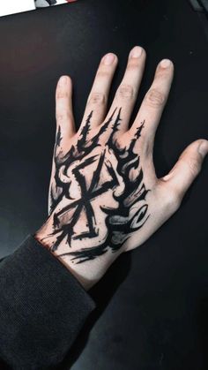 a person's hand with black ink on it