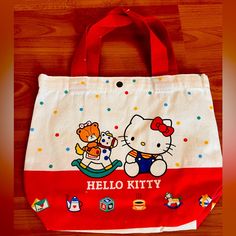 New Without Tags 10”L X 8”H Strap Drop 5” Hello Kitty Print Tote Shoulder Bag For Shopping, White Bucket Canvas Bag For School, White Hello Kitty Bag For Daily Use, White Bag With Cat Design For Shopping, Playful Hello Kitty Bag For Daily Use, Cute Red Shoulder Bag, Playful Red Bag For Gift, White Hello Kitty Print Bag For Daily Use, Casual Hello Kitty Bags For Daily Use