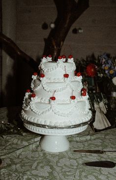 a large white cake sitting on top of a table