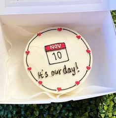 a birthday cake in a box with the date 10 it's our day written on it