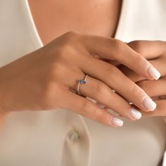 a woman's hand with a ring on it