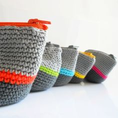 crocheted purses lined up in different colors