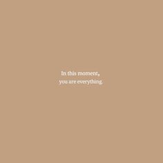 the words in this moment, you are everything on a brown background with white lettering