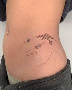 a woman's stomach with a dotted line drawing on it