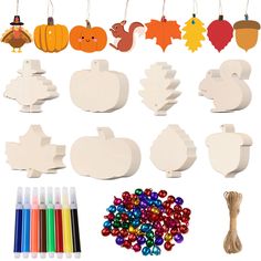 a bunch of wooden cutouts and decorations for thanksgiving or fall with crayons