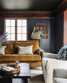 a living room filled with furniture and decor