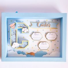 a baby's first birthday card in a blue box with clouds and sheep on it