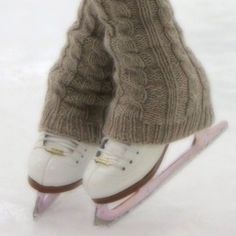 the legs and feet of a person on a sled