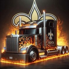 a large semi truck with flames on the side