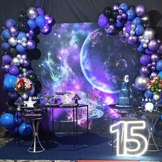 a stage set up with balloons and decorations