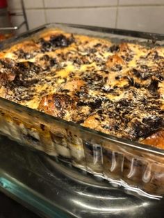 a casserole dish sitting on top of a stove