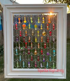 an image of a window with beads hanging from it