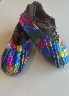 One pair of bowling shoe covers in a  rainbow foil stretchy fabric with a waterproof sole. They have an elastic opening to make them easy to put on or take off in between frames or when running up to check on your bracket scores. You'll keep the soles of your bowling shoes clean and dry with this fun pair. Price includes USPS shipping within the Continental United States.  Fits Men's size 5-7 or Women's size 6-9.  All styles are modeled with a Women's size 9 shoe.  Due to variations in the fabric, some colors may appear slightly different in person.   I make each pair myself and generally buy only 2-3 yards of fabric at a time. Because of this, I can't guarantee that I can get the same fabric again. Some of my offerings sell out quickly, so if you see something you like, don't delay - "str Rainbow Mermaid, Bowling Balls, Bowling Shoes, Shoe Covers, Clean Shoes, Sell Out, A Rainbow, Bowling, Mens Fitness