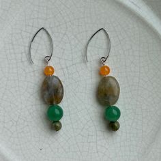 Orange Chalcedony, green Fluorite, Aventurine, and Unakite make a fun statement earring! Available in silver or gold.  Thank you for supporting my small business! Aventurine Natural Stone Earrings, Aventurine Natural Stone Earrings Gift, Bohemian Gemstone Earrings For Everyday, Green Sterling Silver Earrings With Ear Wire, Bohemian Everyday Gemstone Earrings, Green Everyday Earrings, Aventurine Drop Earrings For Gift, Jade Drop Earrings With Ear Wire, Handmade Minimalist Green Jewelry