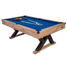 a blue pool table with two cues and one ball resting on the top, against a white background