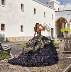 Captivate the room in this strapless ruffled charro ballgown by Ragazza Fashion M12-112. This beautiful dress features a lovely strapless sweetheart bodice embellished with lovely beaded charra embroidery, long A-line ruffled skirt decorated with traditional charro embroidery, eye-catching train, and a lace-up corset back. En Espanol: Una celebración a nuestra cultura y fascinación por el país del mariachi. Este diseño trasmite magia a través de auténtico bordado charro en hilo metálico; con un Gold Charro Dress, Charro Dress, Charro Quince, Charro Quinceanera Dresses, Sweet 15 Dresses, Quince Dress, Quinceanera Party, Corset Back, Ruffled Skirt