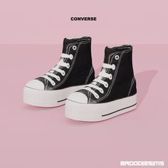 a pair of black and white sneakers with the words converse on them, against a pink background