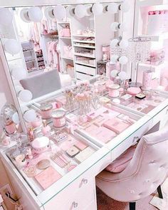 a vanity with lots of pink items on it