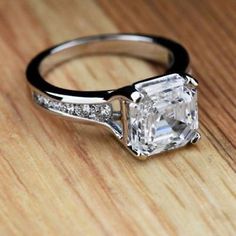 an engagement ring with a square cut diamond in the center