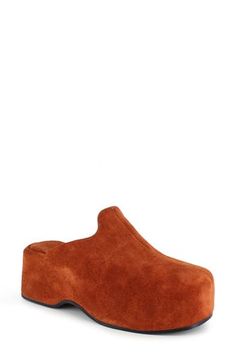 A center seam splits the streamlined silhouette of this contemporary-chic leather clog lofted on a chunky platform. 2 3/4" heel; 1 1/2" platform Water-resistant Leather upper and lining/rubber sole Made in Italy Modern Mules With Reinforced Heel And Round Toe, Modern Chunky Platform Slip-on Mules, Modern Slip-on Clogs With Reinforced Heel, Modern Clogs With Reinforced Block Heel, Modern Synthetic Clogs With Block Heel, Modern Clogs With Removable Insole And Round Toe, Suede Platform Slip-on Mules, Chic Brown Platform Slippers With Round Toe, Modern Slip-on Closed Toe Clogs