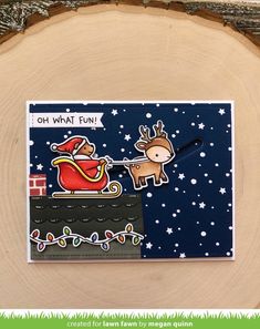 a handmade christmas card with a reindeer pulling a sleigh