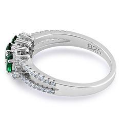 Top of ring height: 7.3mm

         Top of ring width: 11mm

      Band width:  3.6mm

      Shank width: 1.8mm

    
        Stone material:  green & clear cubic zirconia

      Center stone size: 5mm x 3mm

      Stone shape:  oval (center) & round

      Center stone carat    weight: 0.2 ct.

      Total number of CZ    stones: 53

      Stone setting:  prong setting

   
       Metal:  925 sterling silver

      Plating:  rhodium plated    (what is rhodium?) What Stone Material, Stone Setting, Cz Ring, Emerald Ring, Cz Stone, Stone Settings, Rhodium Plated, Prong Setting, Cubic Zirconia