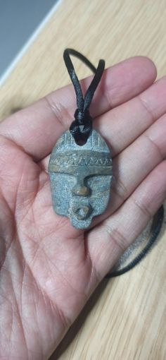 This ancient African mask shaped stone necklace is completely handmade and carefully crafted.  It creates a different impression and effect with its authentic structure.  Suitable for gifting to your loved ones, family or friends. African Face Mask, Mask Shapes, Necklace African, Face Necklace, Mask Necklace, African Mask, Antique Stone, African Masks, Stone Necklace