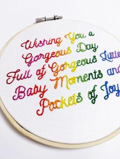 a cross - stitch pattern with the words,'wishing you a gorgeous day full of gorgeous smiles, baby moments and pockets of joy '