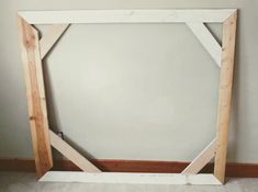 an unfinished frame is sitting on the floor