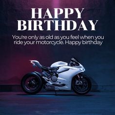 a motorcycle is parked in front of a birthday card