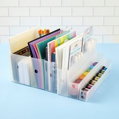 an office desk organizer with pens, pencils and other crafting supplies in it