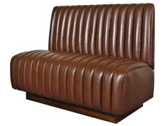 a brown leather couch sitting on top of a wooden table