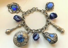 Unique 7" Etruscan Silver w/ Blue Gems & Stones Fob Charm Bracelet w/ 2 Lockets | eBay Antique Blue Bracelet As Gift, Antique Blue Bracelet Jewelry, Blue Victorian Metal Jewelry, Blue Vintage Nickel Free Bracelets, Vintage Blue Nickel-free Bracelets, Vintage Blue Nickel-free Bracelet, Antique Blue Metal Jewelry, Blue Gems, Locket