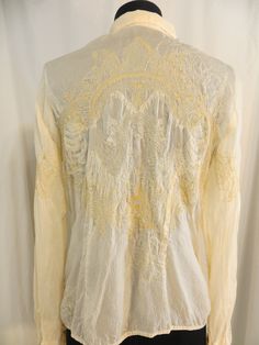 "Johnny Was - there is no wonder why this designer is so popular! Fabulous styling and quality. This is a very special shirt, on top of being detailed and beautiful - the back has an angel embroidered. Fabric feels like silk but is 100% Rayon. Washable. Medium, marked L but please go by the measurements. Shoulder 16\", Bust is 40\", Waist 38\", hem circumference is 42\", and length is 24\". Well made, excellent construction, pretty color - a peachy ivory. Nice detail on cuff, ribbon closure. One Embroidered Fabric, An Angel, Johnny Was, Blouse Vintage, Embroidered Shirt, Pretty Colours, Lace Top, Shirt Blouses, Blouses For Women