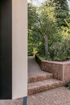 a brick patio with steps leading up to it