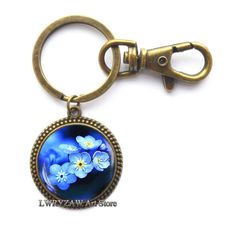 PRICES MAY VARY. Material: Alloy & Glass Cabochon ,Color:as shown Christmas Keychain,best gift to your friends,family Keychain Size: 3.5cm*2.8cm,Cabochon Diameter: 2.5cm,Base Diameter:2.5cm. 100% Brand New And High Quality.Handmade item,Packing gift bag,Everyday keychain,Fast delivery Beautiful handmade Keychain for yourself or loved one.Chirstmas Gift,photo jewelry,wedding jewelry，valentines day gifts,best friend gifts,birthday gifts,anniversary gifts,friendship gifts Material: Alloy & Glass Ca Friend Gifts Birthday, Family Keychain, Christmas Keychain, Keychain Blue, Chirstmas Gift, Packing Gift, Flower Keychain, Glass Theme, Handmade Keychain