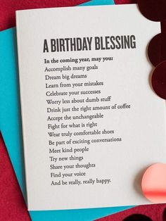 a birthday blessing card sitting on top of a table