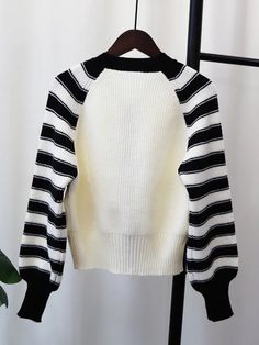 Fabric: Knit Trendy White Ribbed Sweater, White Ribbed Sweater For Spring, White Ribbed Knit Sweater, White Stretch Knitted Sweater, White Stretch Knit Sweater, White Chunky Knit Stretch Sweater, White Stretch Sweater With Chunky Knit, White Stretch Chunky Knit Sweater, White Pointelle Knit Sweater