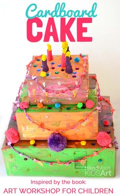 a cake with candles on it and the words card board cake written in pink above