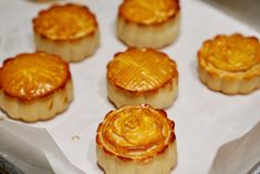 there are many small desserts in the tray on the table, ready to be eaten