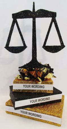 Scales of Justice centerpiece - Designs by Ginny College Graduation Party Centerpieces, Retirement Party Centerpieces, Vendor Table Display, Graduation Centerpiece, Vendor Table, Greenery Flowers, Graduation Party High, Retirement Ideas, Law School Graduation