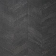 an image of a black and white wall with wood grained pattern on the surface